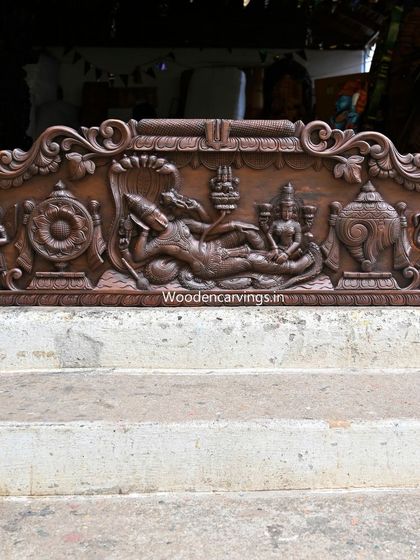 This 48-inch horizontal panel shows Narayanar (Lord Vishnu) reclining on Adisesha. The antique brown finish provides a classic, sophisticated look, detailing the story of Lord Padmanabar with his divine attendants.