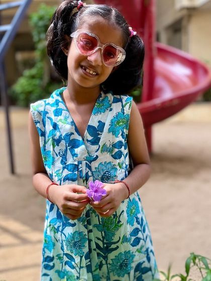 Another look at our Pakshi Kurta, which can be worn as a dress. The beautiful blue floral print and comfortable fit make it a go-to outfit for any day.