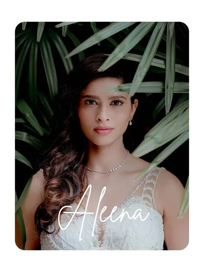 A striking portrait of the bride framed by lush green leaves, her name elegantly scripted. This shot is both modern and timeless.