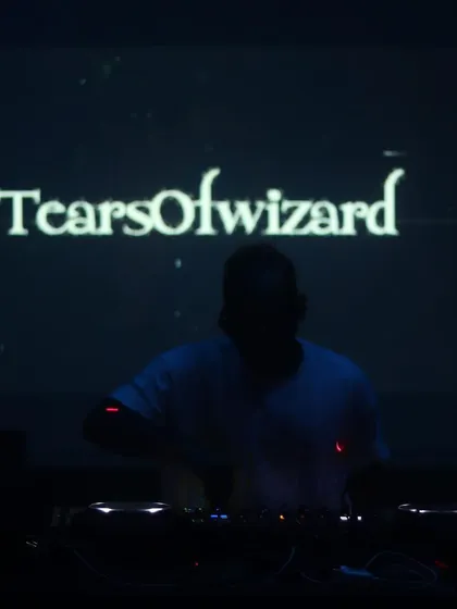 Me in my element, just a silhouette against my moniker, Tears of Wizard. This is the dark, hypnotic, and trippy side of my techno sets, perfect for late-night club sessions.