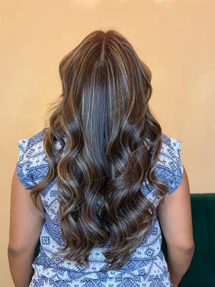 A view from the back of our cool ash blonde creation. Notice how the highlights are woven through the hair for a seamless, natural blend.