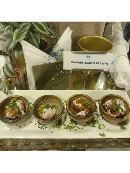 Wasabi Tossed Prawns served in small bowls, a zesty and modern appetizer that adds a kick to any party menu.