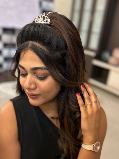 A close-up of the client, showing the details of her hairstyle and her happy expression.