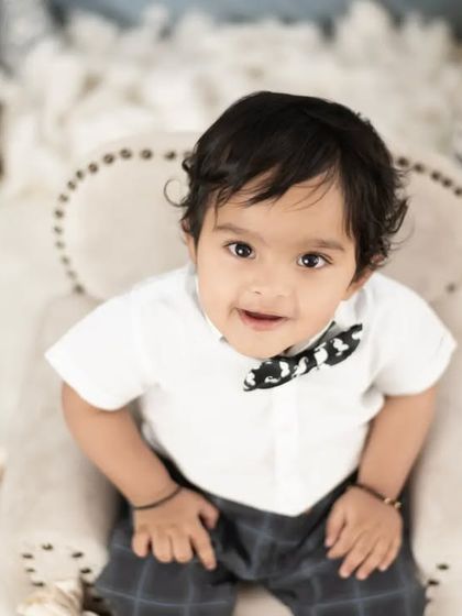 A top-down view of the Boss Baby, looking right up at the camera with an inquisitive expression.