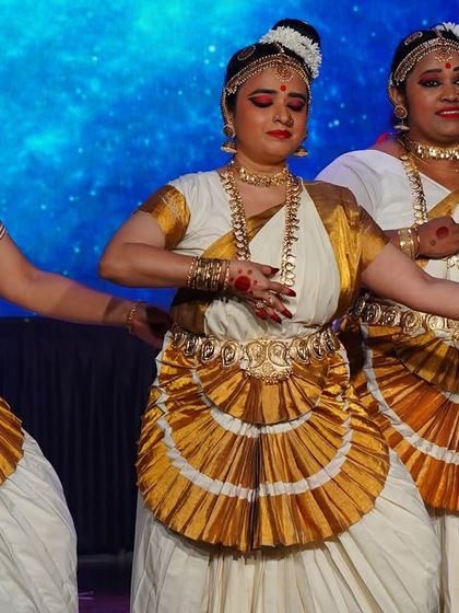 A close-up of our Mohiniyattam performers, showcasing their detailed makeup, traditional hairstyles, and the delicate hand gestures that tell stories.
