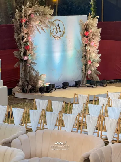 A wider shot of the outdoor sangeet area, with comfortable lounge seating for guests to relax and enjoy the performances.