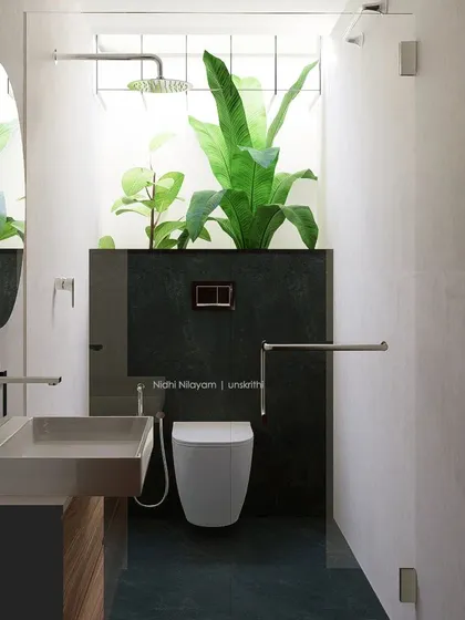 I believe bathrooms should be personal sanctuaries. This design brings nature indoors with a skylight and a dedicated planter for large-leaf plants, creating a serene, spa-like atmosphere. The minimalist design, with its clean lines and natural light, turns a daily routine into a calming ritual.