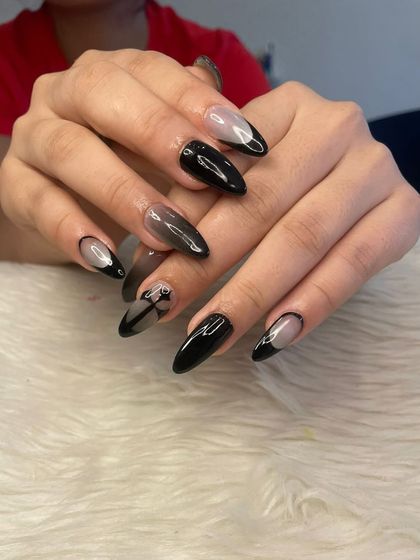 A full view of the spooky black nail set, showing the different designs on each hand.