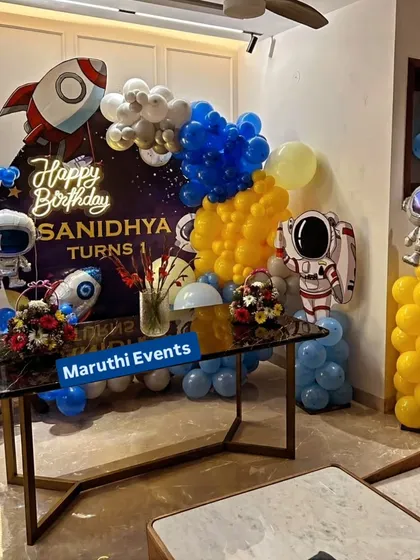 3, 2, 1, blast off! This outer space theme is perfect for aspiring astronauts. The setup includes a galaxy backdrop, rocket and astronaut balloons, and a color scheme of deep blues, yellows, and silver to create an out-of-this-world experience.