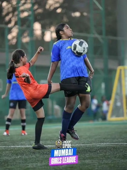 A Bravo player bravely shields the ball with her body while an opponent attempts a high kick. This image shows the toughness and game intelligence of our female athletes.