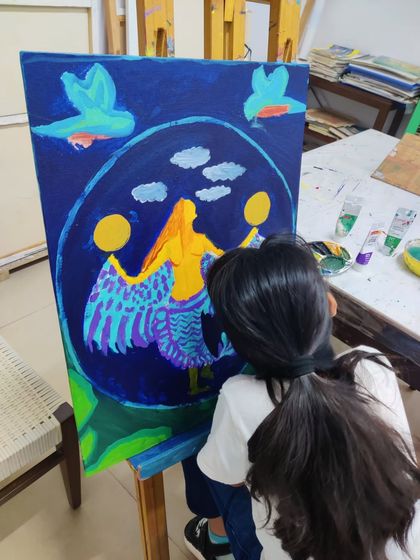 These images document the creation of a whimsical mermaid painting, showing the layering of colors and development of the composition.