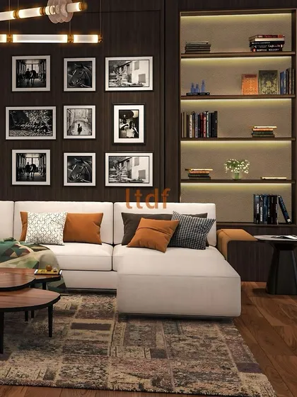 A detail shot of the living space, focusing on the curated gallery wall of black-and-white photographs. This personal touch adds a layer of storytelling, while the illuminated bookshelf provides both functional storage and a warm, ambient glow.