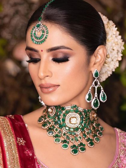 A softer, more romantic angle of the emerald bridal look. The closed eyes showcase the beautiful blend of the eyeshadow, a key detail in my makeup application.