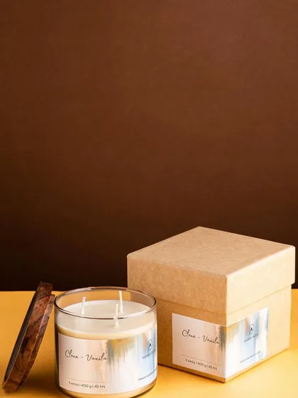 Indulge in a spa-like experience at home with our Clove & Vanilla soy candle. Housed in a simple glass jar with a wooden lid, its warm fragrance is perfect for creating a soothing and luxurious atmosphere.