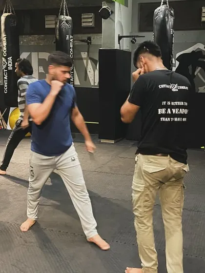 Two students spar, with one wearing the shirt "It is better to be a weapon." This captures the essence of our philosophy: be prepared.