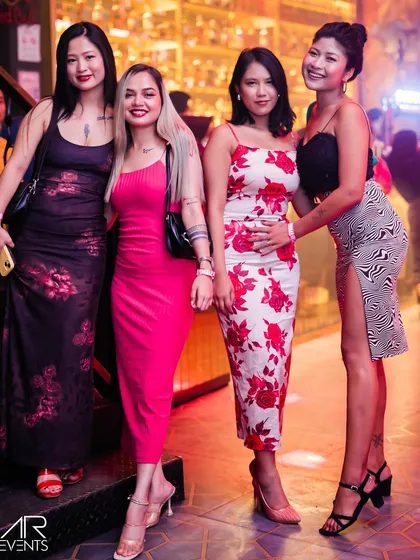 A group of stylishly dressed guests.