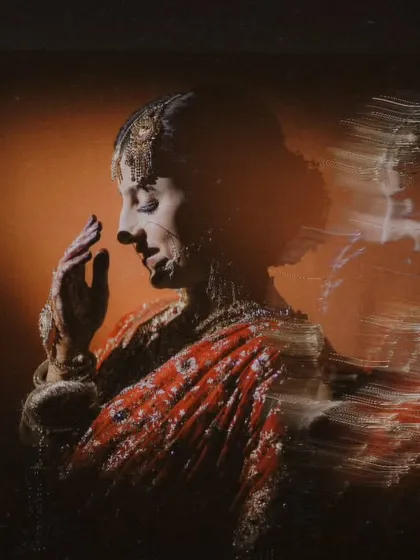 An experimental bridal portrait using a slow shutter speed to create a motion blur effect. This technique adds a dynamic and ethereal quality to the image, perfect for an artistic shoot.