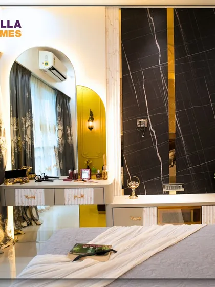 A closer look at the dressing and TV unit in the Parisian master bedroom. We used a mix of black marble, gold accents, and an arched, backlit mirror to create a glamorous and functional corner.