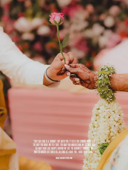 A close-up shot from a Haldi ceremony, focusing on the exchange of a single rose. This image highlights the small, symbolic gestures that are so meaningful during wedding rituals.