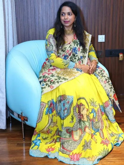 My prestigious client looks absolutely beautiful flaunting this mythological concept Kalamkari lehenga. The vibrant yellow skirt is hand-painted with intricate scenes, and I've paired it with a full-sleeve blouse and a contrasting dupatta.