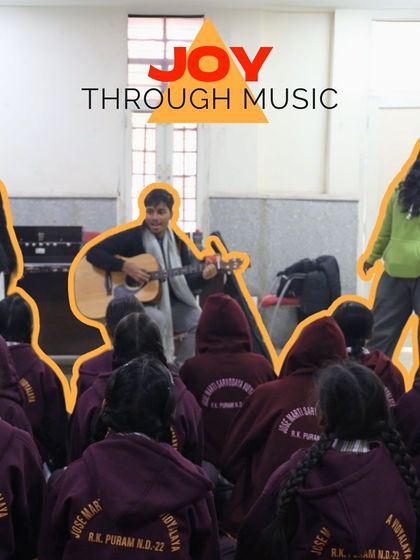 "Joy Through Music." This image shows our fellows leading a group of students in a joyful song and dance, their energy lighting up the room.