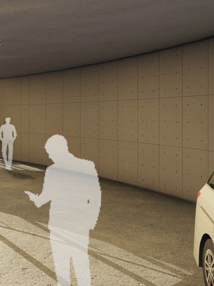 A rendering of the curved driveway and entrance to a modern commercial building. The design emphasizes clean lines and simple materials, creating a functional yet aesthetically pleasing approach to the structure.