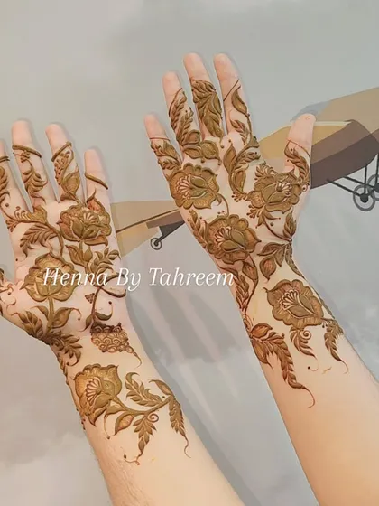 This is a beautiful, full-coverage floral design that extends up the arm. The delicate rose motifs and trailing vines create a romantic and organic look that is perfect for any special occasion.
