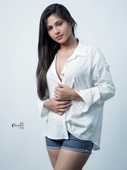 This variation of the white shirt and denim shorts look is both casual and stylish, perfect for lifestyle branding.