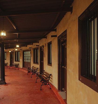 The charming cottages at this eco-retreat in Sakleshpur are built using traditional mud architecture. The long verandas with pillars and red oxide flooring offer a perfect spot to relax and soak in the panoramic views of the Western Ghats.