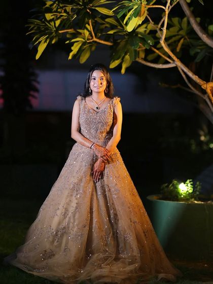 A full-length portrait in the garden.