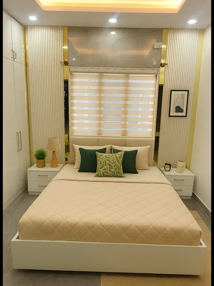 This modern contemporary bedroom from a 3BHK project in Bannerghatta showcases our skill in blending minimalism with luxury. We used a palette of soft neutrals and gold accents, complemented by grooved wall panels, high-gloss wardrobes, and warm cove lighting to create a cozy yet sophisticated space.