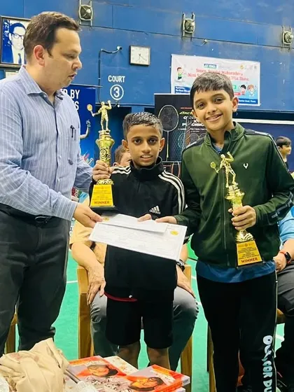 Adhiraj Shetty and his partner receiving their Gold medals for the BD U11 category at the Yonex Sunrise Maharashtra Mini State Badminton Championship.