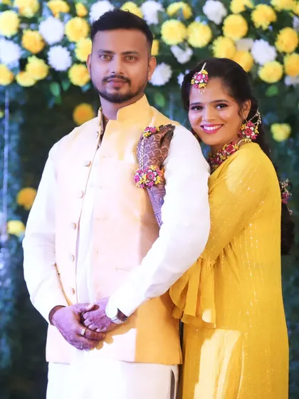 A warm embrace, capturing the love between the couple on their special day.