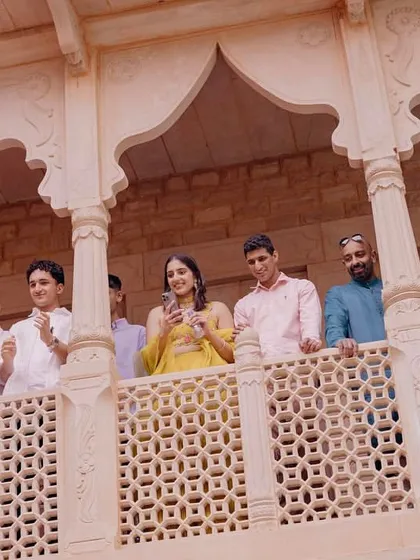Guests enjoying the vibrant Haldi ceremony from the beautiful balconies of Khimsar Fort.