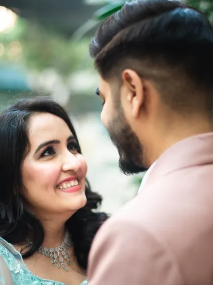 A bride-focused shot, capturing her joyful smile as she looks at her groom. This complements the previous shot perfectly.