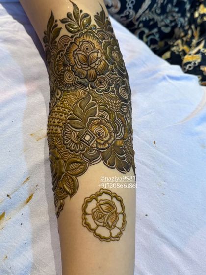 A detailed shot of a full arm design with fresh paste.