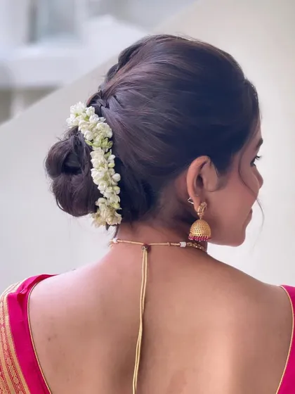 A back view of the South Indian bridal bun, showing the beautiful gajra and braided detail.