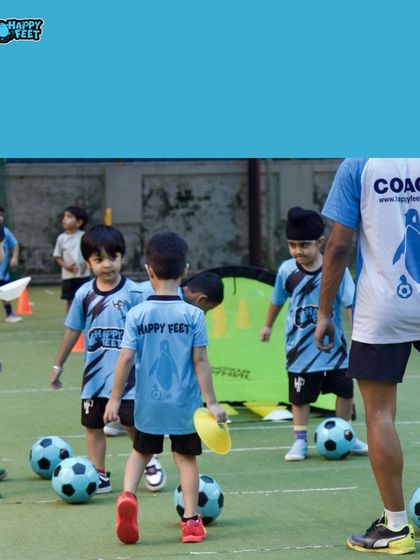 Our field is always buzzing with activity. In this shot, kids are getting ready for a drill, each with their own ball, ensuring maximum participation and learning time for everyone in the group.