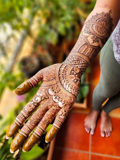 A beautiful bridal design featuring peacocks and elephants, classic symbols of Indian weddings.