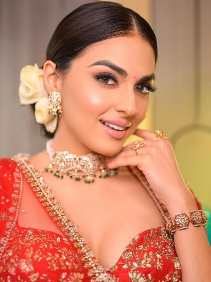 A close-up that proves less is more, even for a traditional bridal look. The skin is radiant, the smile is genuine, and the makeup is simply there to enhance her beauty.