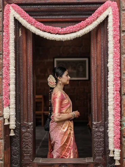 Another angle of this bride's wedding look. The focus is on her serene expression, enhanced by the subtle and elegant makeup.