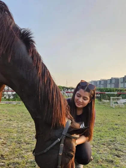 A rider shares a quiet, affectionate moment with her horse. This is the therapeutic side of the equestrian lifestyle.