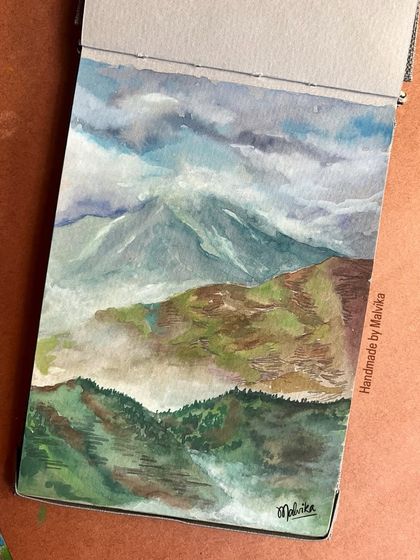 The full sketchbook page of my 'Daydreams' watercolor. Seeing the art on the textured paper gives a sense of the handmade process and the personal nature of these paintings.