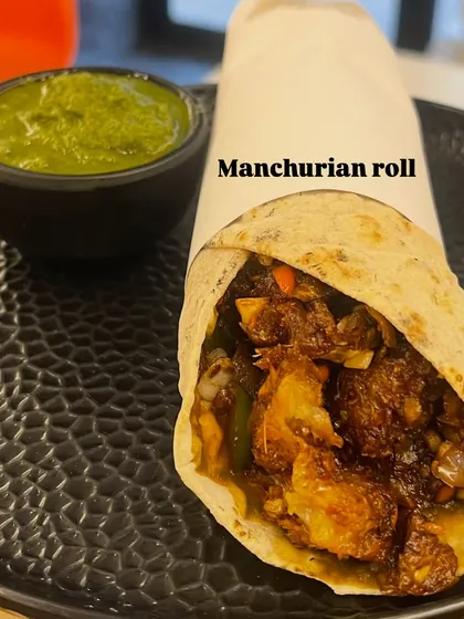 My Manchurian Roll is the perfect on-the-go meal. It's a soft roti filled with spicy and saucy vegetable Manchurian, served with a side of fresh green chutney.
