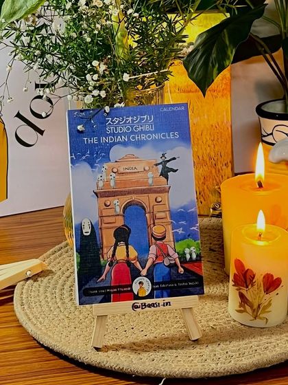 The calendar set up in a cozy corner with some candles. It’s designed to bring a little bit of warmth and magic to any space.