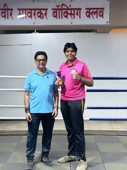 Posing with a champion. It is my honor to guide these young boxers and celebrate their victories with them inside our home gym.