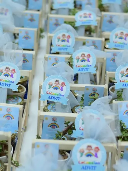 Themed return gifts for Advit's Cocomelon party, beautifully arranged in custom wooden crates.