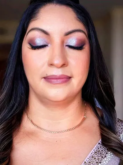 A close up of the beautiful and graceful groom's mother. The shimmery eyeshadow brightens her eyes, and the skin looks smooth and radiant.