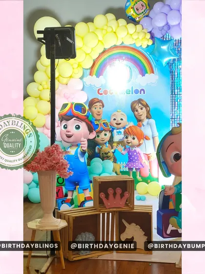 Another detail from the Cocomelon party, showing the welcome sign and floral arrangements.