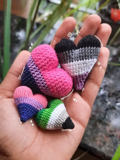 As a queer artist, making Pride art is so important to me. I can create these little hearts in any Pride flag colors, perfect as pins, keychains, or earrings to show off who you are.